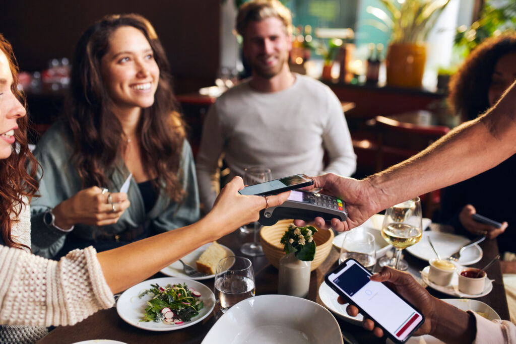 Group friends splitting bill